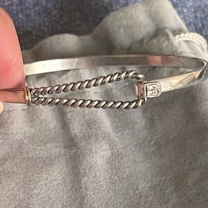 Beautiful Sterling Silver bracelet with 14 k gold Trim, with four diamonds.